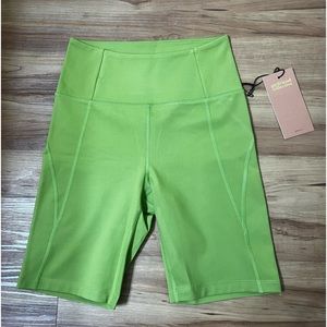Girlfriend Collective green biker shorts.